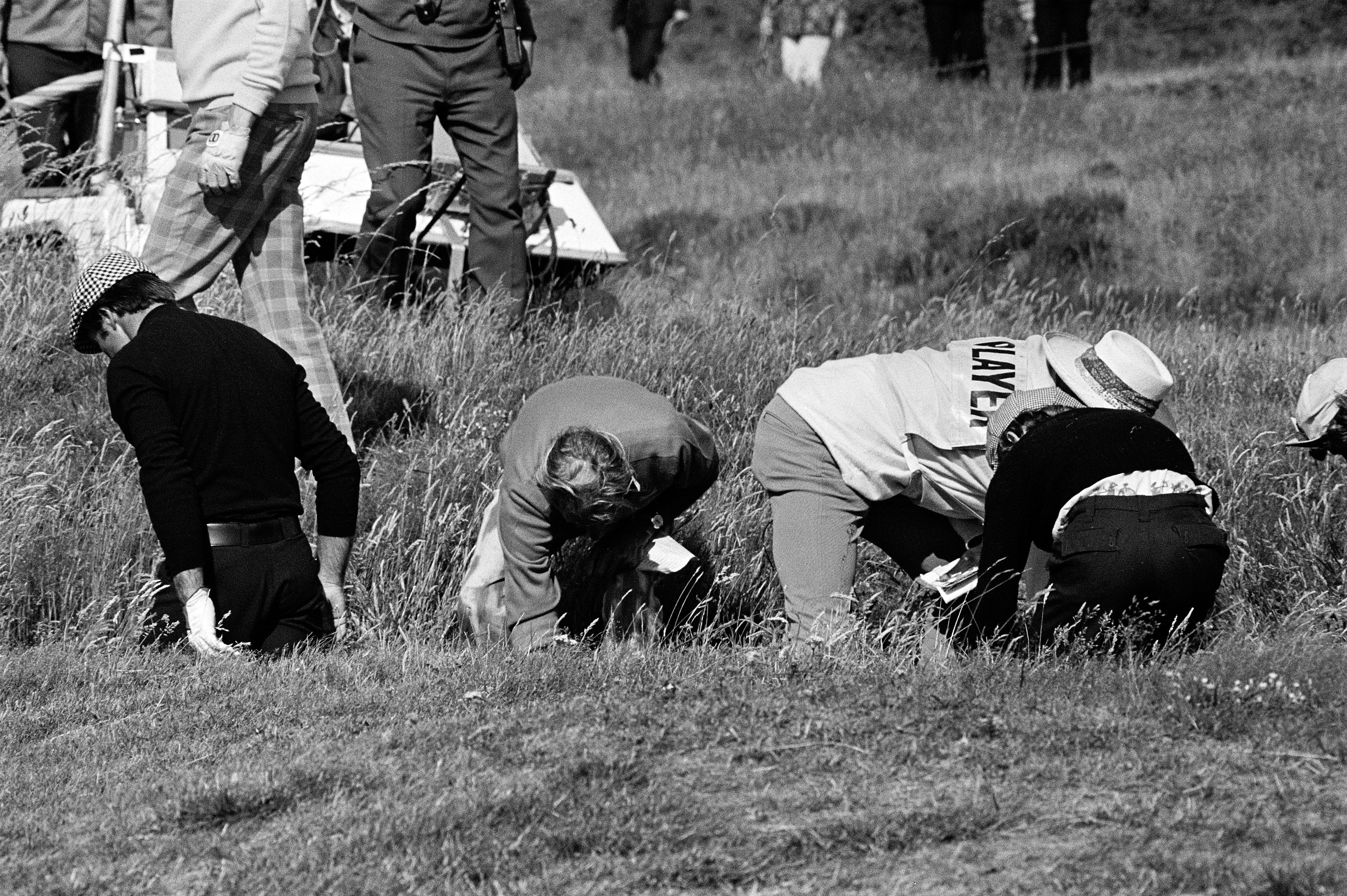 Gary Player and Rabbit Dyer search for Player's lost ball on the 17th hole of Lytham at the 1974 Open Championship.