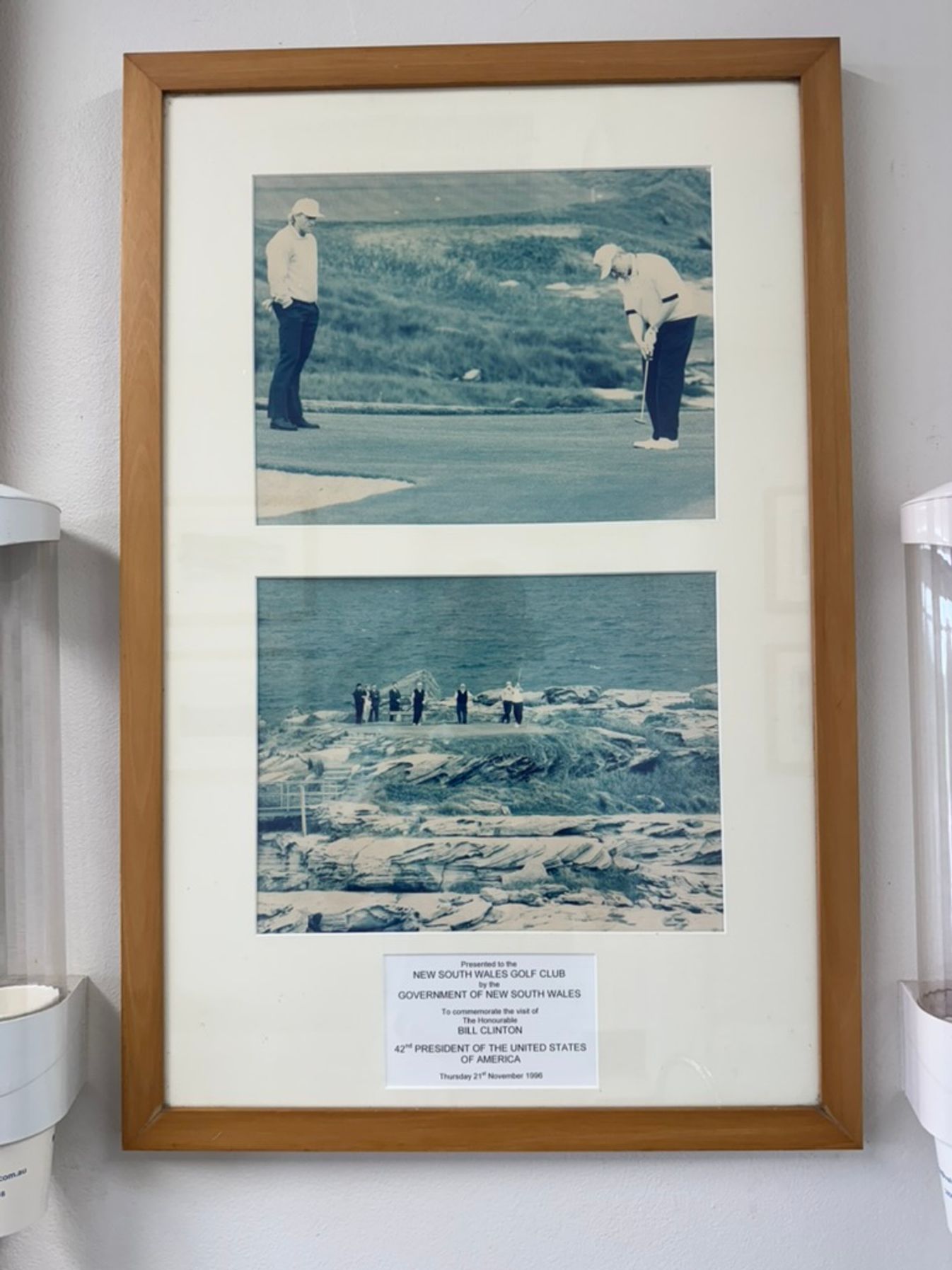 A framed photo of Bill Clinton's visit to New South Wales.