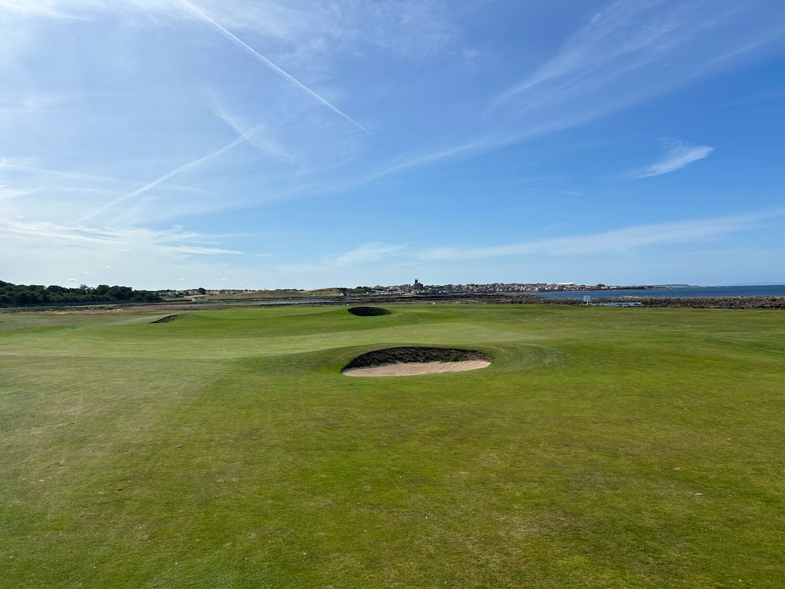 The 15th hole at Dunbar. That’s my ball just left of the fairway bunker, which somehow stayed out of the death zone.