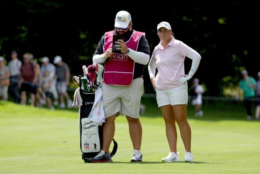 Lauren Coughlin and her caddie, John Pond, strategize their next shot in the final round of the Evian Championship.