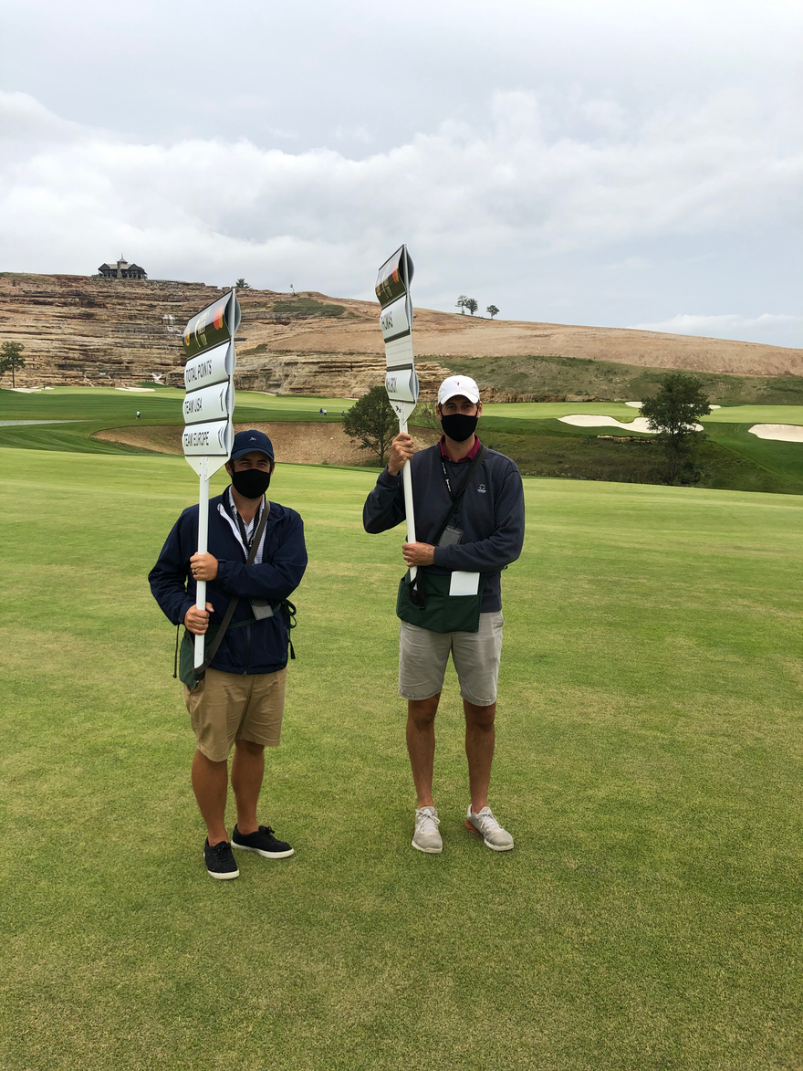 I don't totally remember why Randy and I went to the opening of Tiger's Payne's Valley course at Big Cedar Lodge, but I remember that the standard bearer was exhausted after 15 holes (shout out to that course's routing) and asked us to step in and carry the signs the rest of the way, much to the surprise of Justin Thomas and Rory McIlroy.