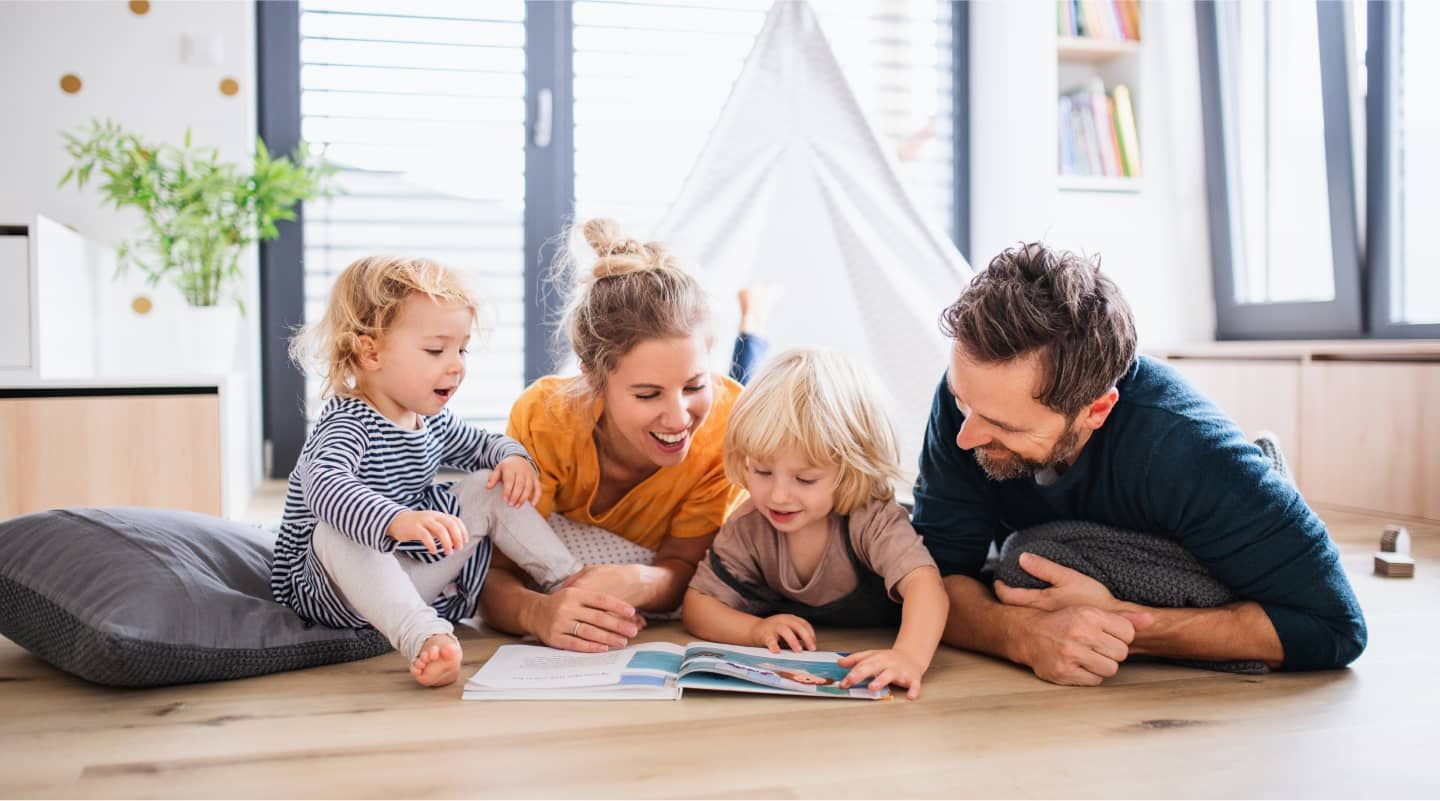 happy family reading a book