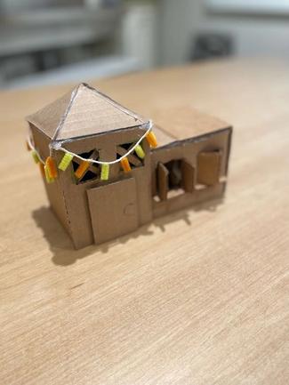 A small house made out of cardboard