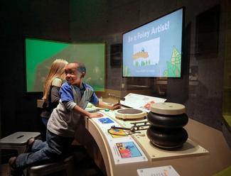 Children recording sound effects in a foley studio