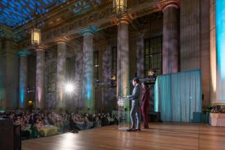 Event co-chairs, Jason and Sepe Zuccari, on stage at the National Children's Museum Play Soiree