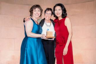 Kiryn Hoffman, Kathy Hirsh-Pasek, and Michelle Kang on stage at the National Children's Museum Play Soiree