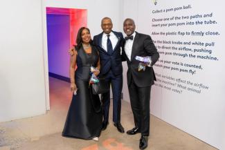 Three people posing at the National Children's Museum afterparty
