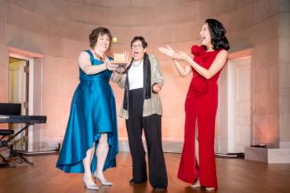 Kiryn Hoffman, Kathy Hirsh-Pasek, and Michelle Kang on stage at the National Children's Museum Play Soiree