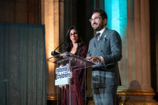 Event co-chairs Sepe and Jason Zuccari on stage at the National Children's Museum Play Soiree