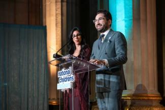 Event co-chairs Sepe and Jason Zuccari on stage at the National Children's Museum Play Soiree
