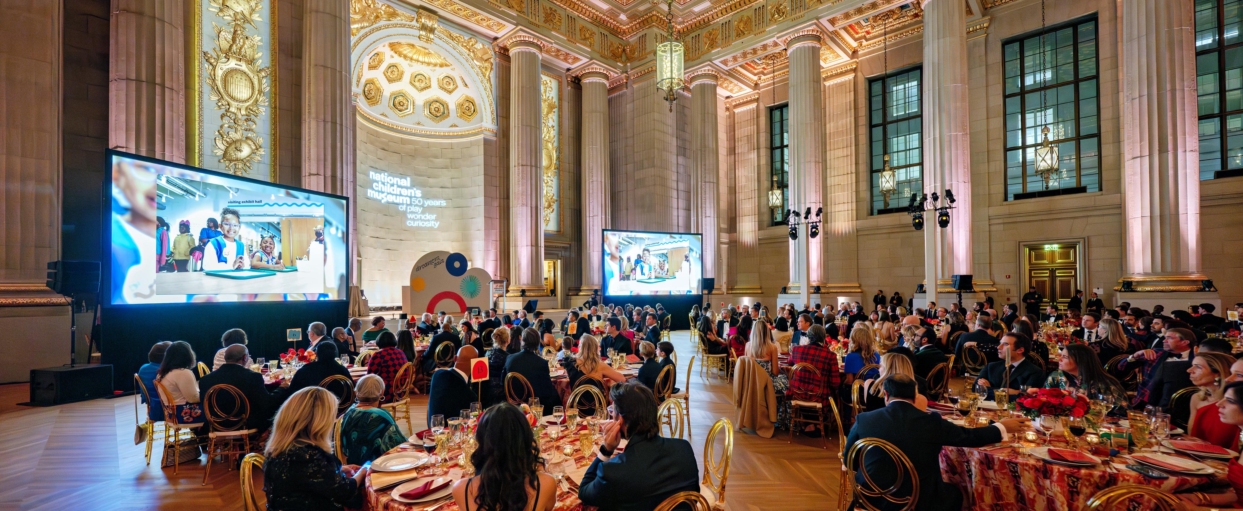 A wide shot of the Mellon Auditorium during National Children's Museum's Dreamers Gala