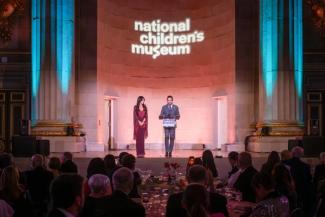 Event co-chairs Sepe and Jason Zuccari on stage at the National Children's Museum Play Soiree