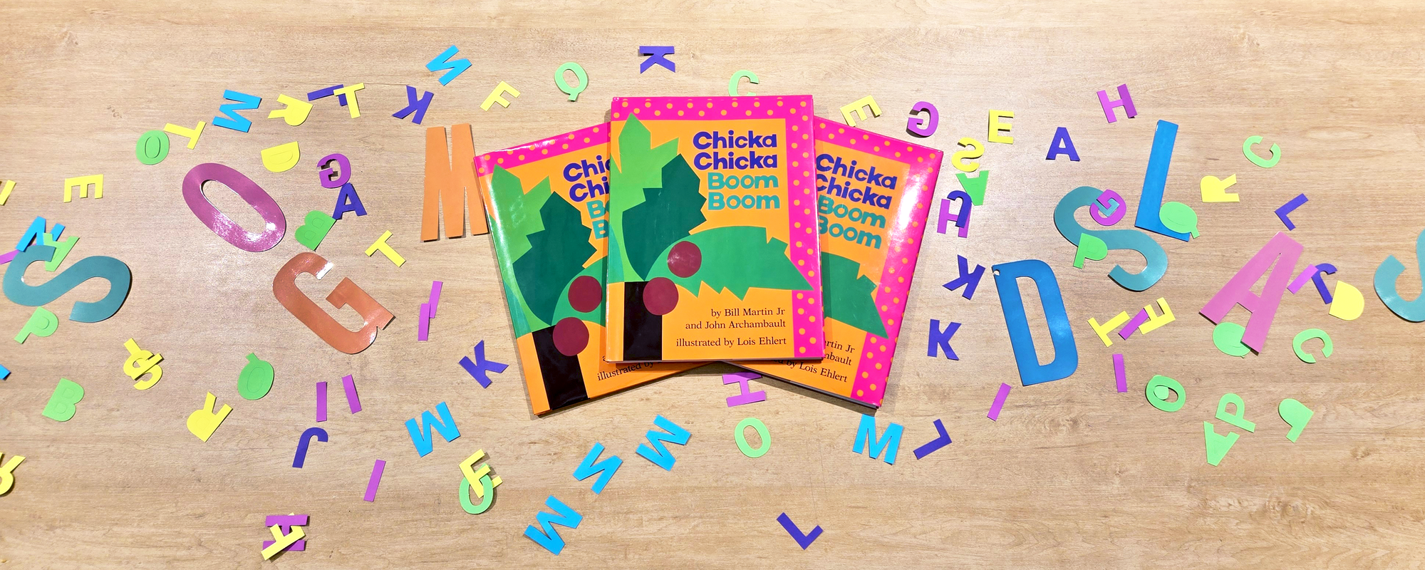 Copies of the book Chicka Chicka Boom Boom surrounded by paper letters