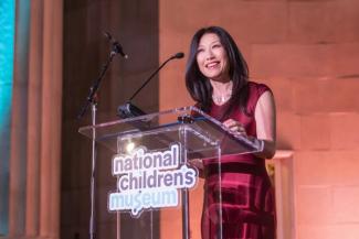 Eun Yang on stage at the National Children's Museum Play Soiree at the Mellon Auditorium