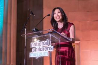Eun Yang on stage at the National Children's Museum Play Soiree at the Mellon Auditorium