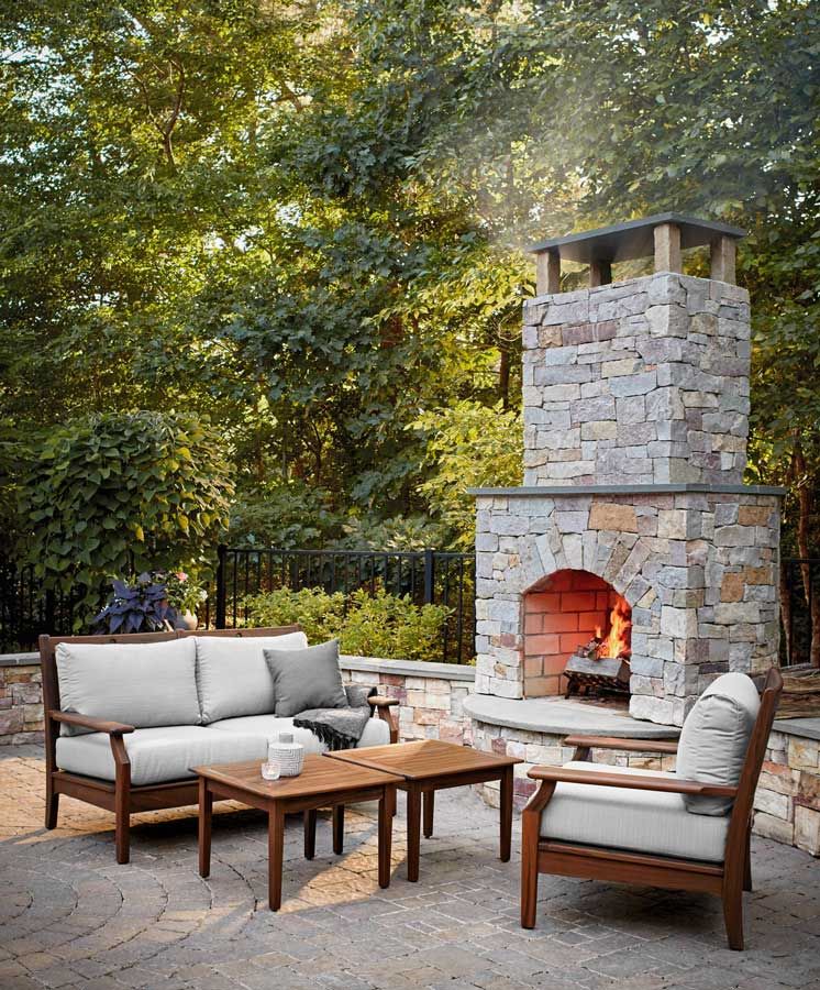 Large Stone Fireplace on a Patio next to Patio Furniture | Patio Life