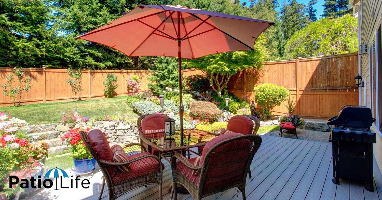 A Small Patio with Patio Furniture Around a Table with an Umbrella | Patio Life