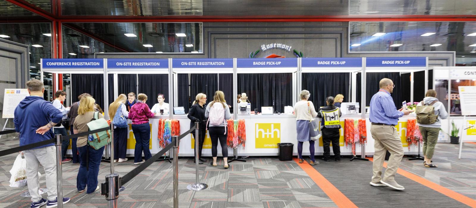 Registration booths at the h+h americas trade show