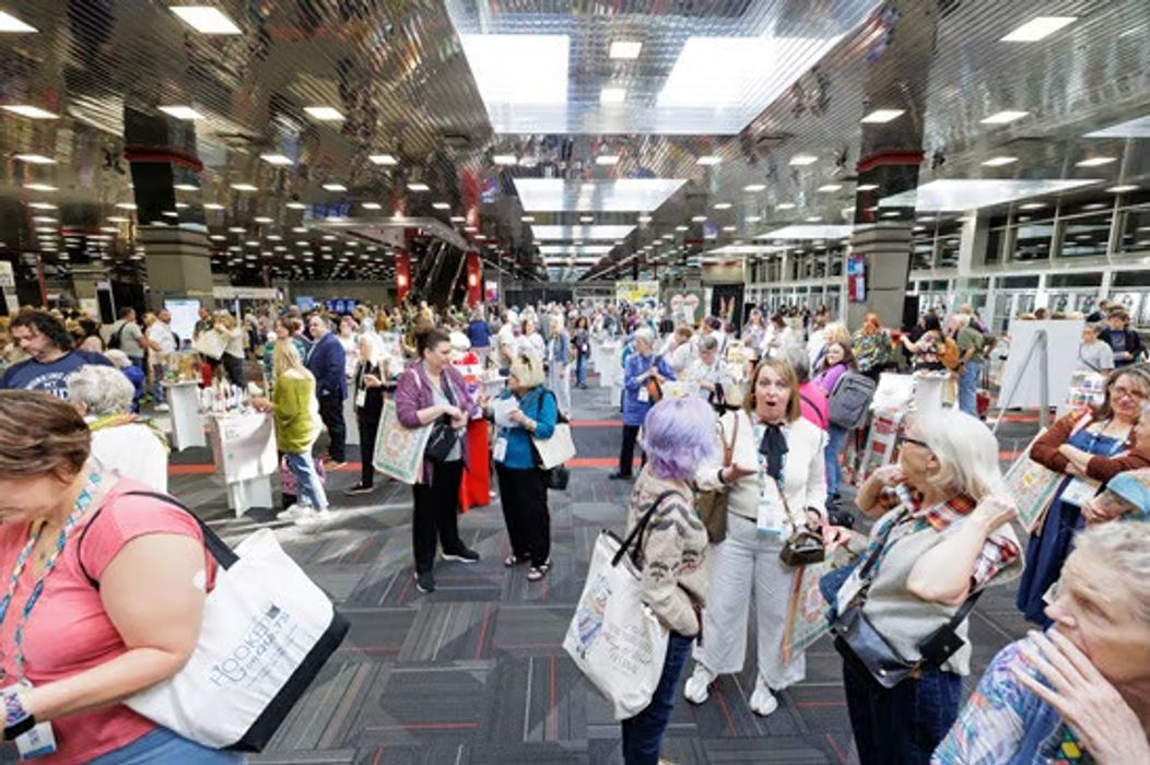 Group of attendees on the trade show floor 