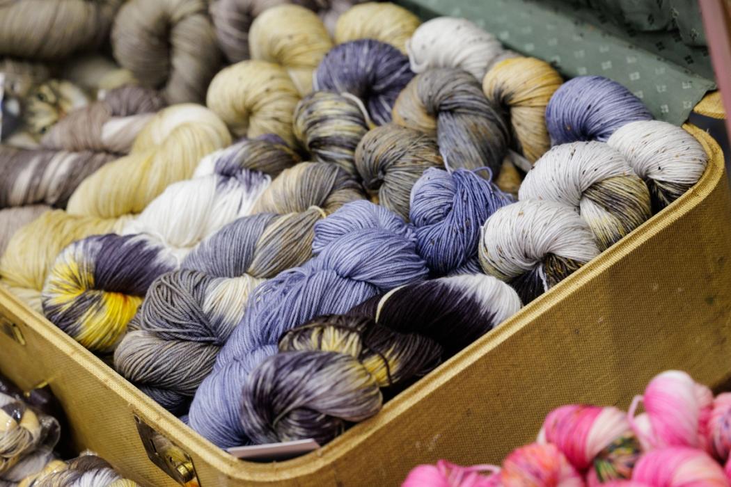 Shelves of yarn in a range of colours at a craft supply store