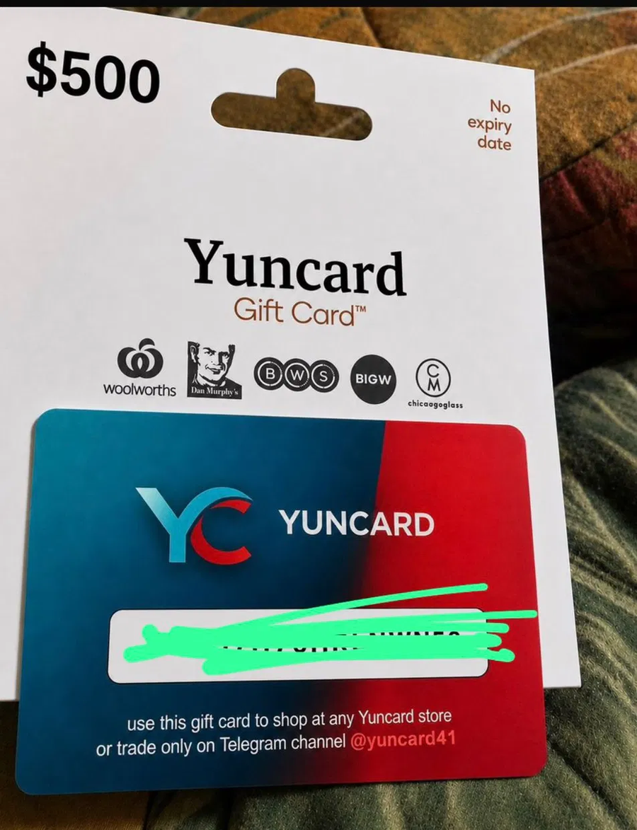 Photo of a suspected AI-generated Yuncard gift card with distorted text and blurred barcode