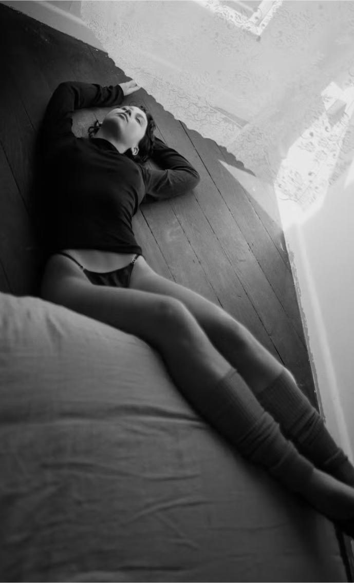 Girl Laying Over Bed
