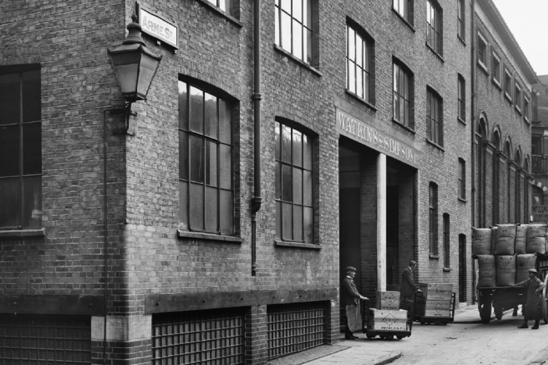 A black and white image from 1918 of a seed merchant's warehouse and loading bay