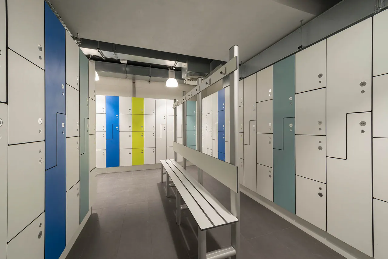White, green, and blue lockers in a changing room