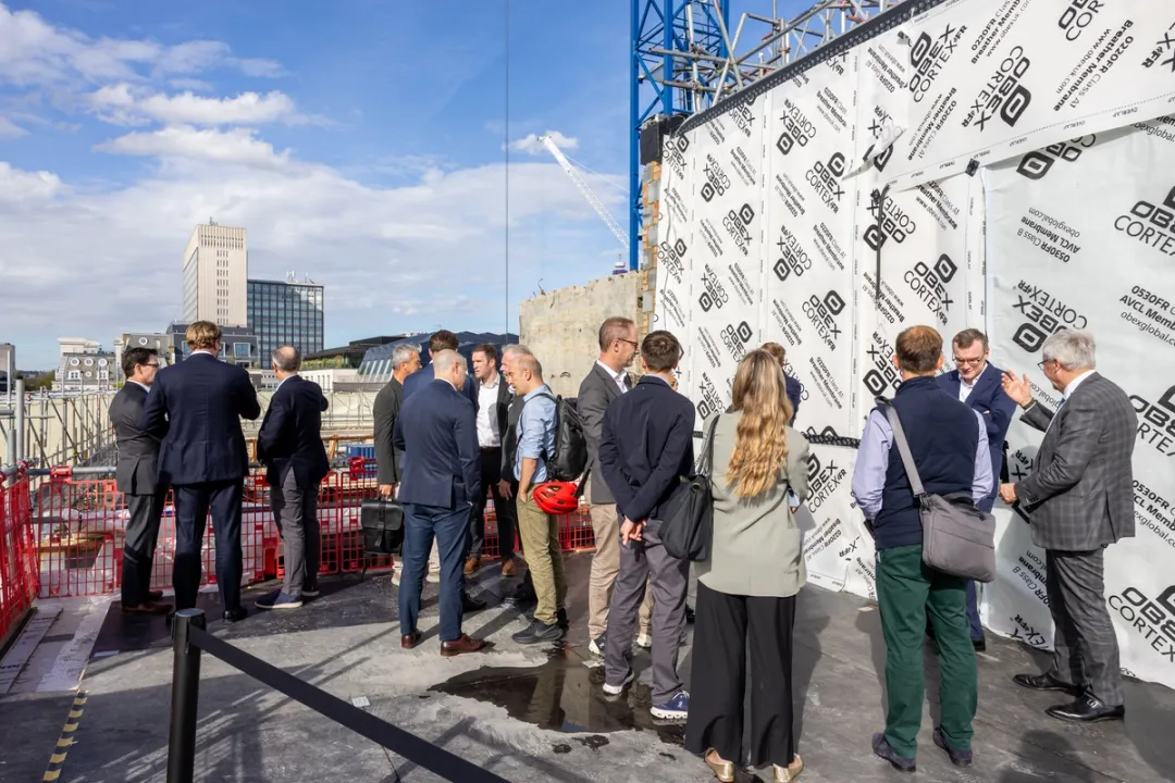 Photograph of people at topping out ceremony