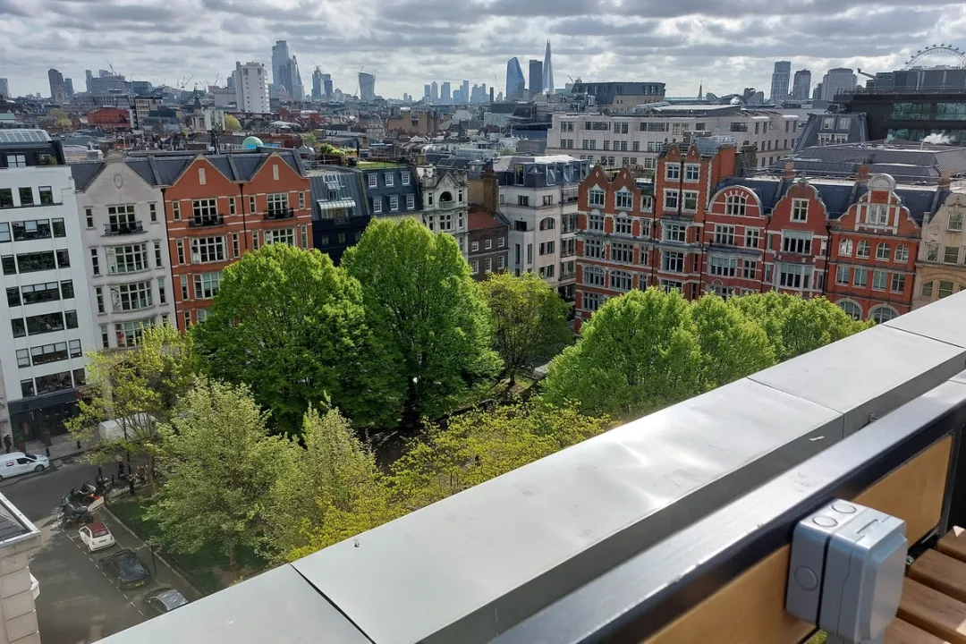 A view from on top of 30 Golden Square looking down on to surrounding buildings and London skyline