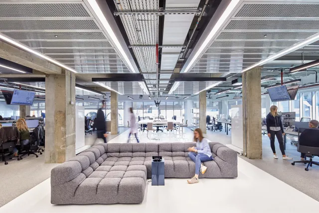 interior view of office with people and sofa