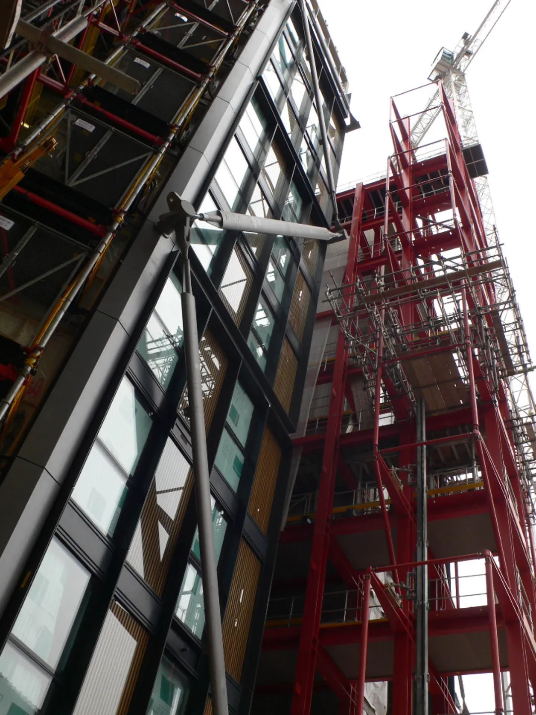 View upwards of glass cross-braced tower construction