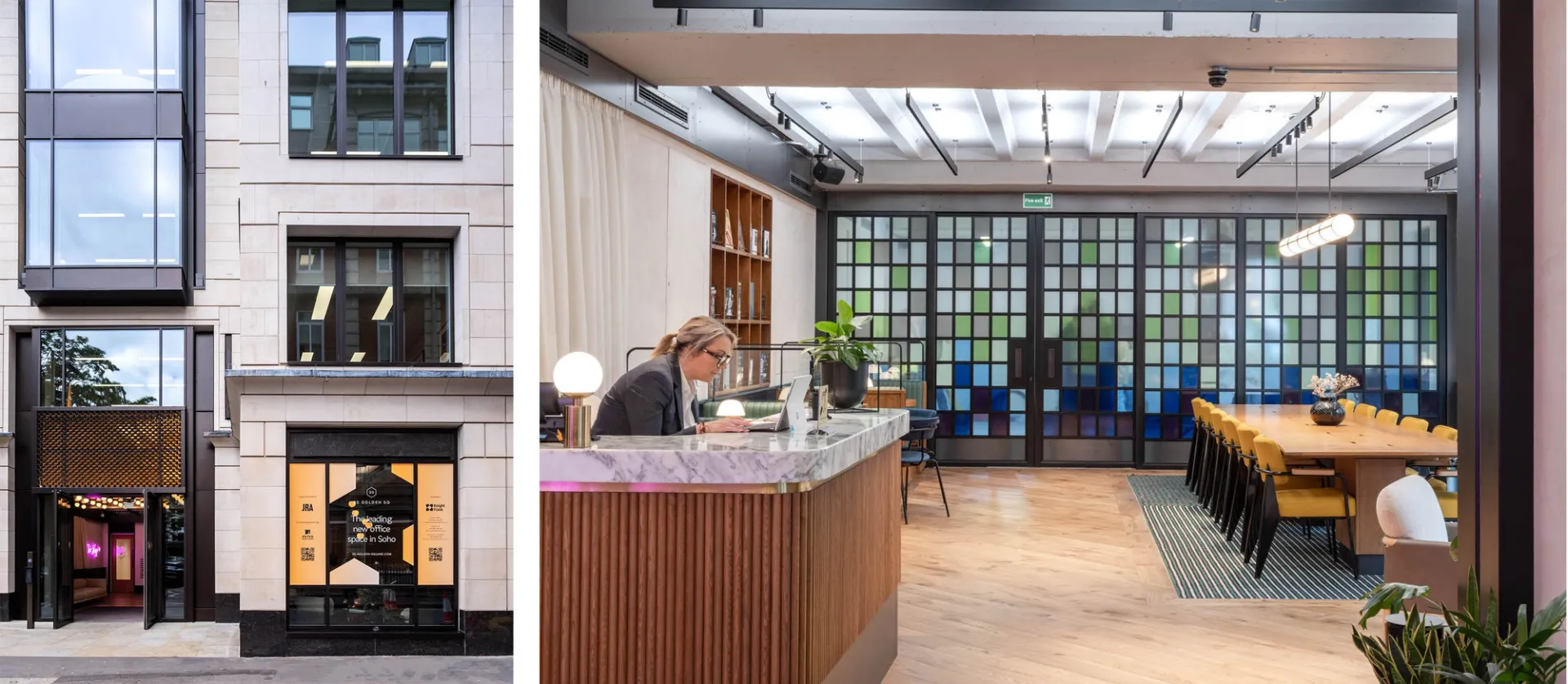 A Receptionist at a wood and marble reception desk in an office lobby with large meeting table and blue and green glass screen doors behind
