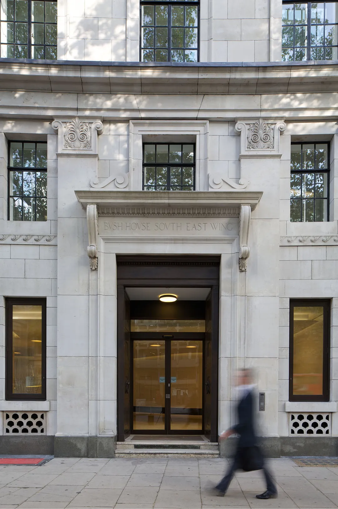 entrance to building with person walking in front