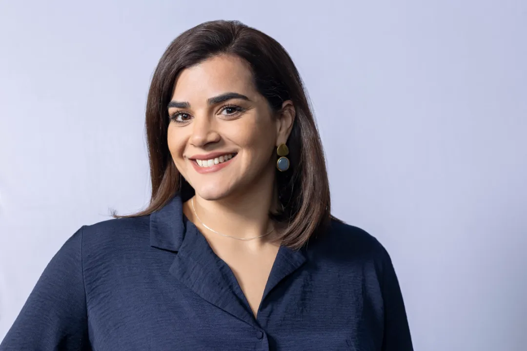 Women smiling in blue shirt