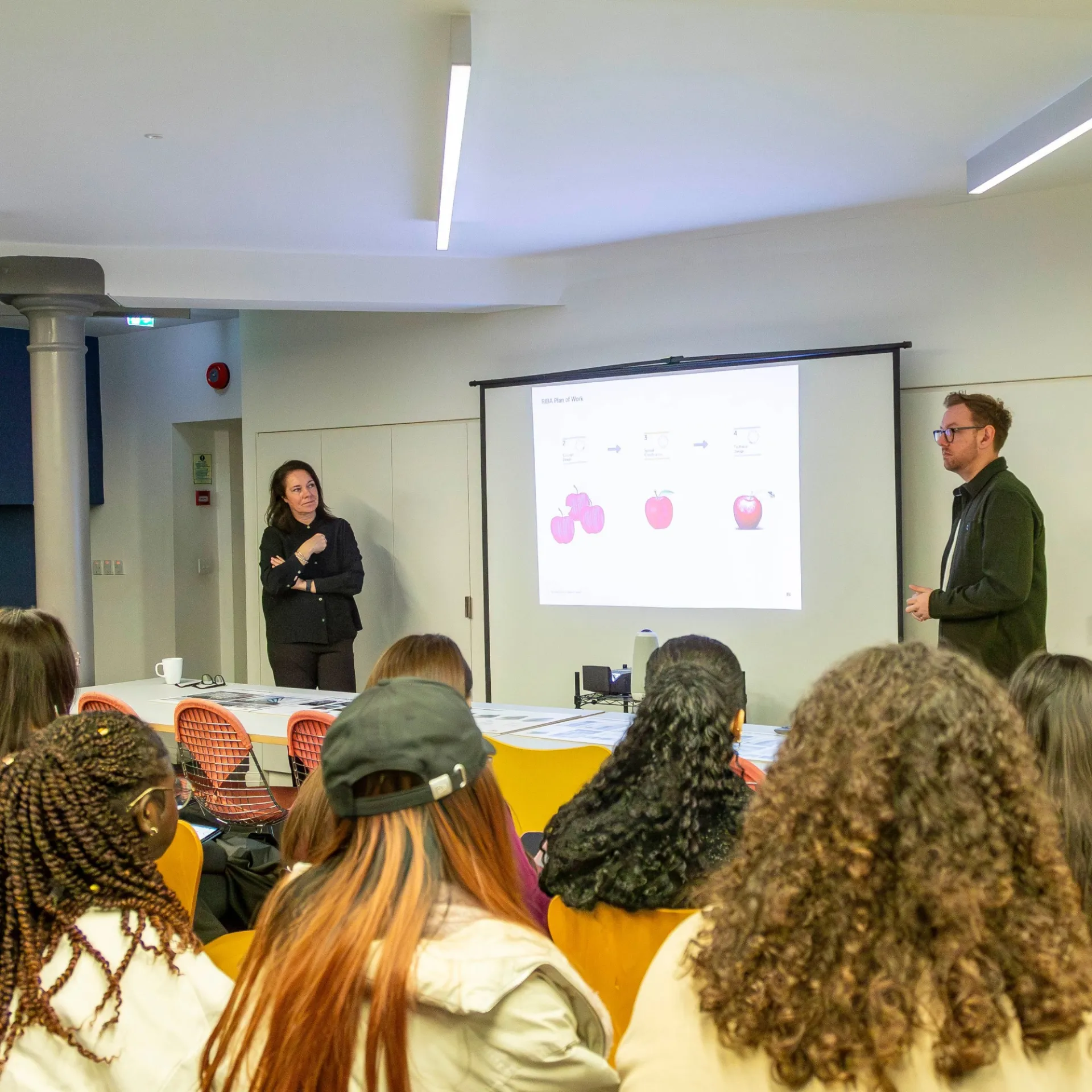 Two people teaching class