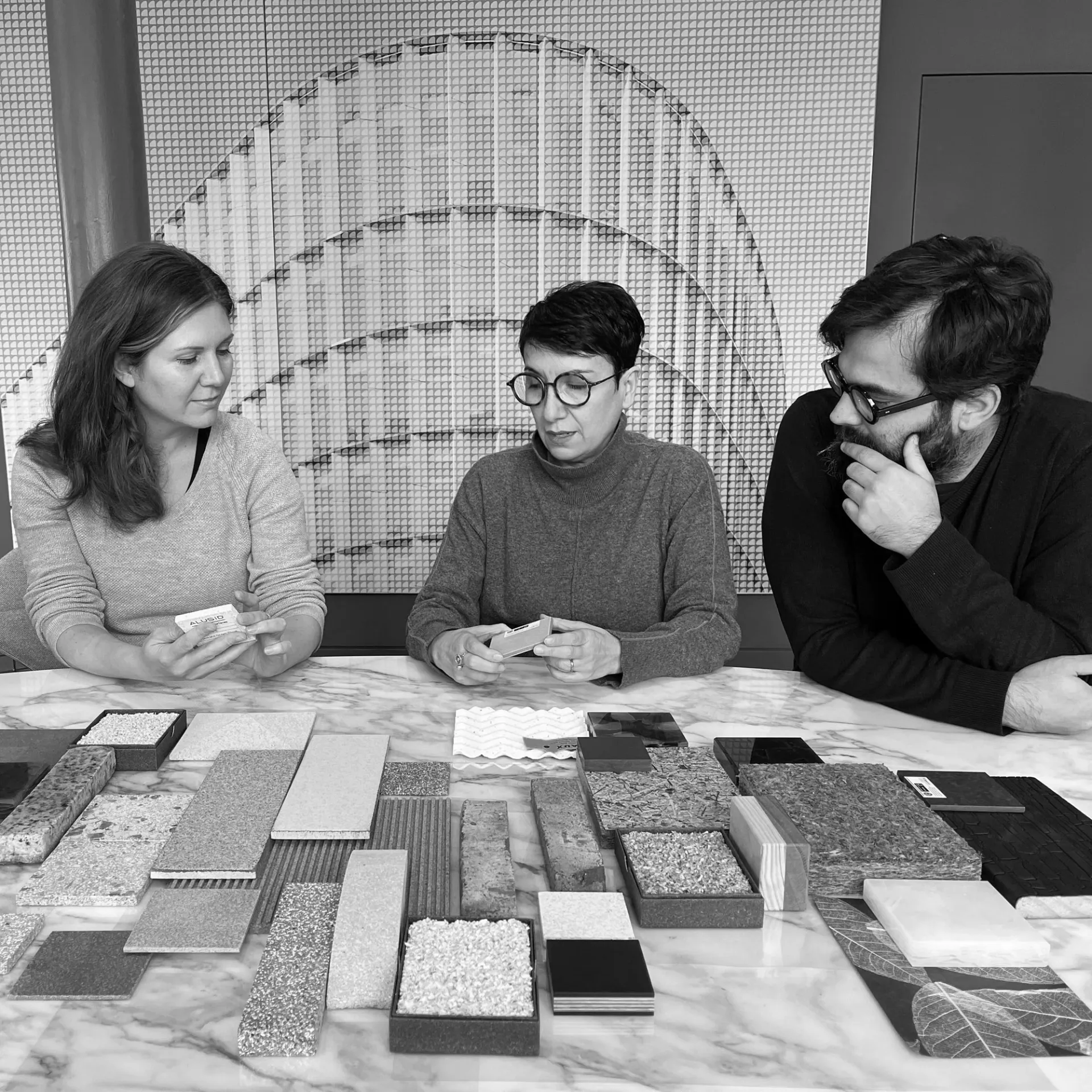 people looking at materials