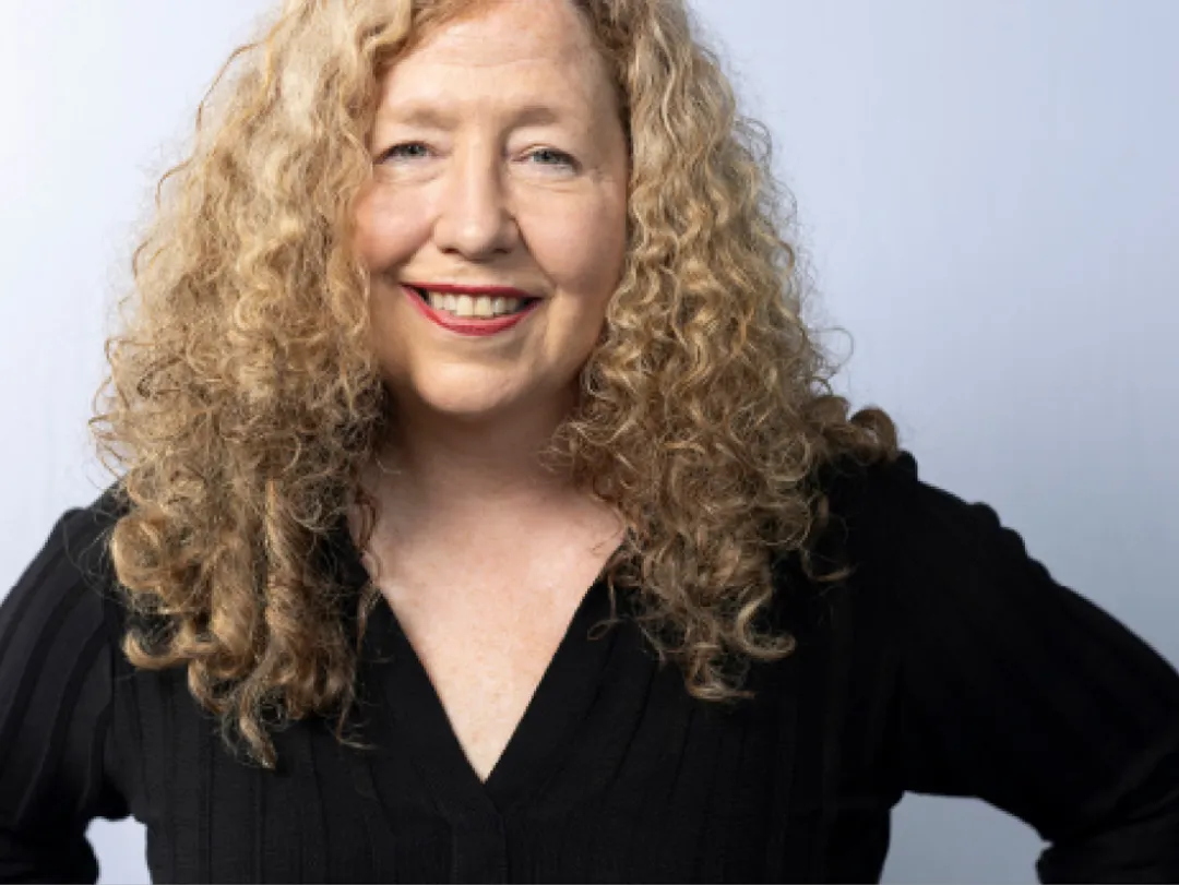 Portrait of person in blue shirt