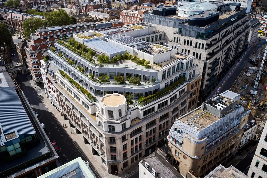 aerial view of building with rooftop terraces