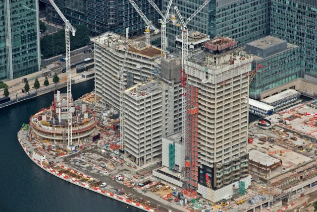 Aerial view of three building shells under construction