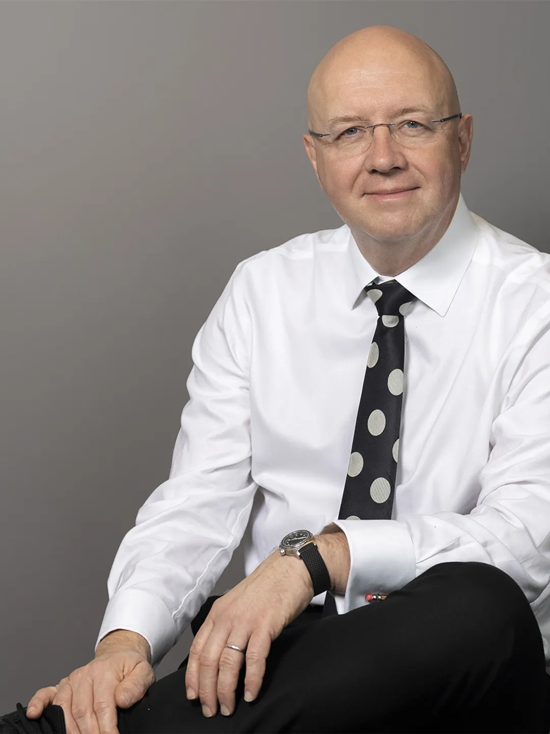 Portrait of person in white shirt with tie