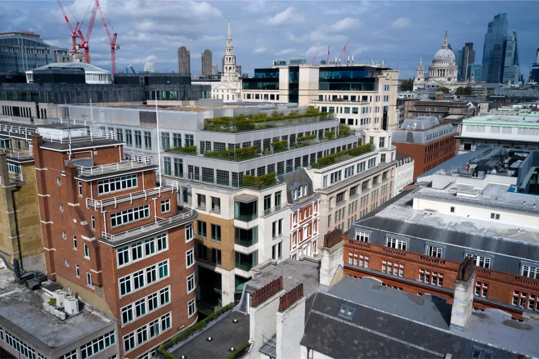 aerial view of building with rooftop terraces