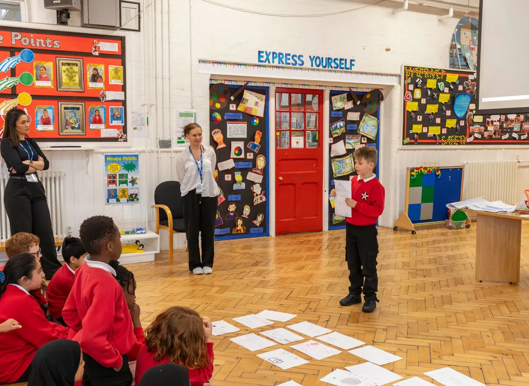 Student presenting his work to the class
