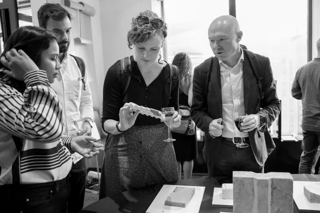 people interacting with materials exhibition