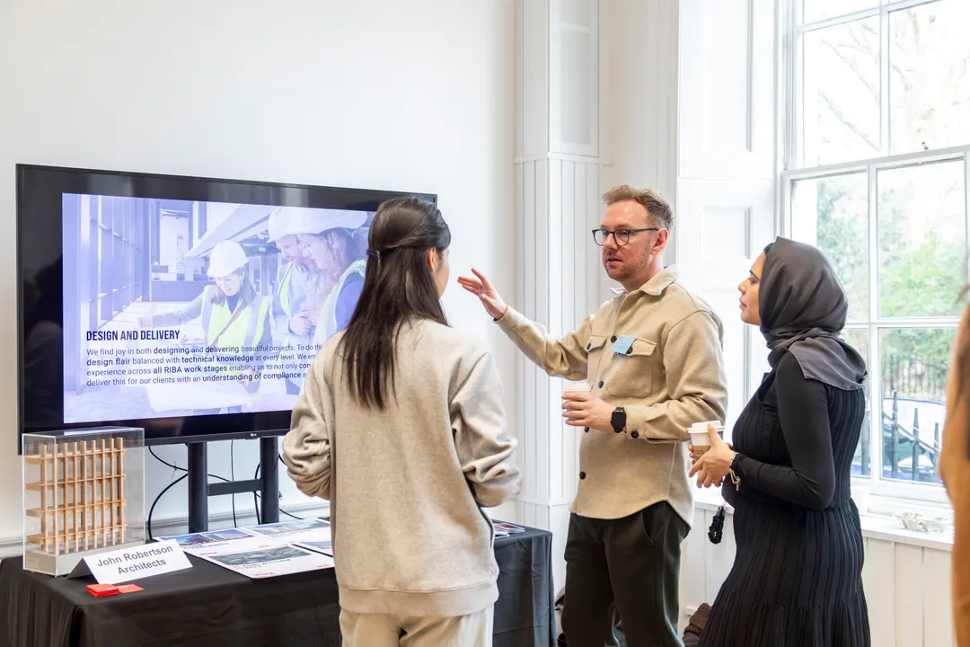 Architect talking to students