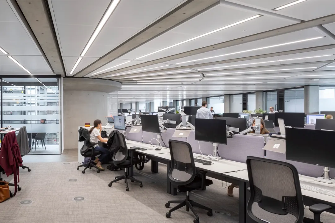Interior view with some occupied desks