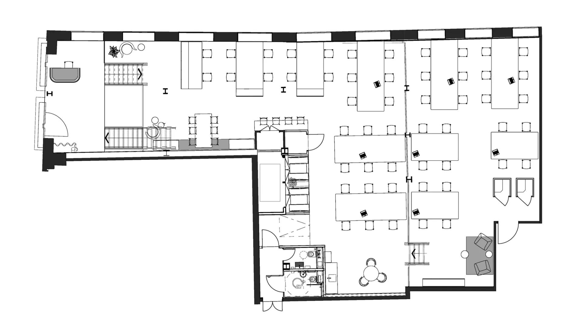 A ground floor office plan showing open plan desks and breakout space