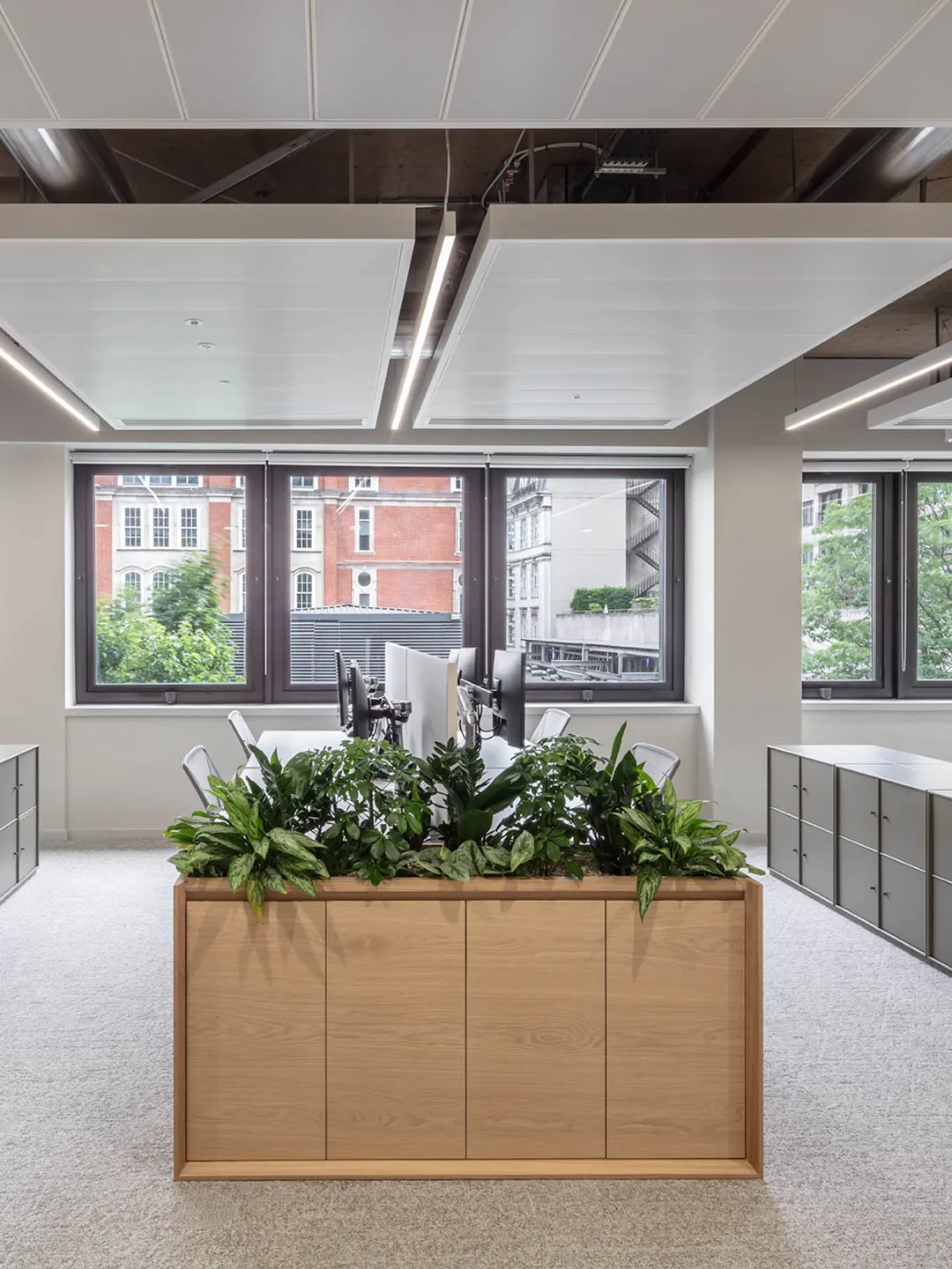 Wooden planter at the end of a desk