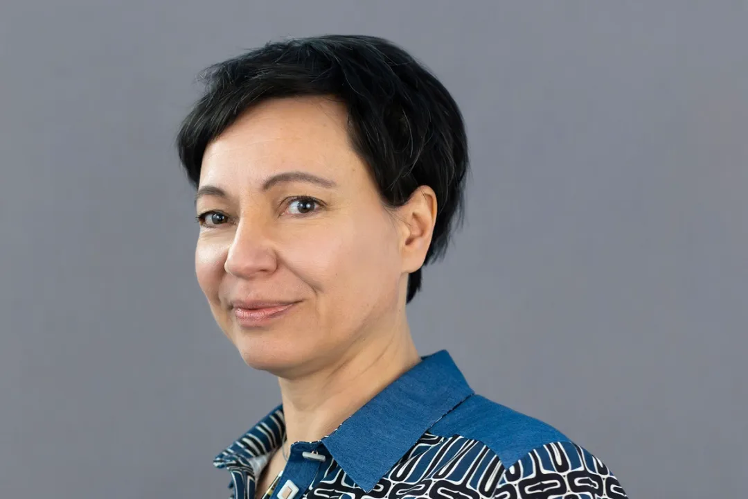Portrait of woman in patterned shirt