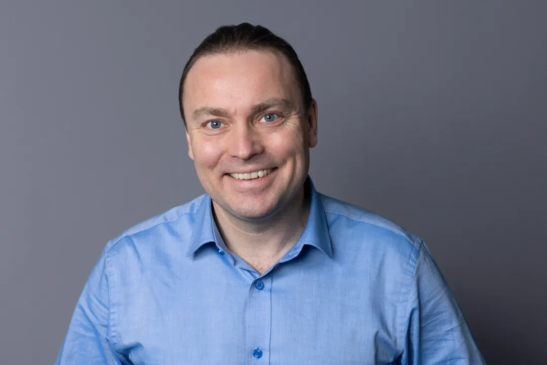 Portrait of man in blue short